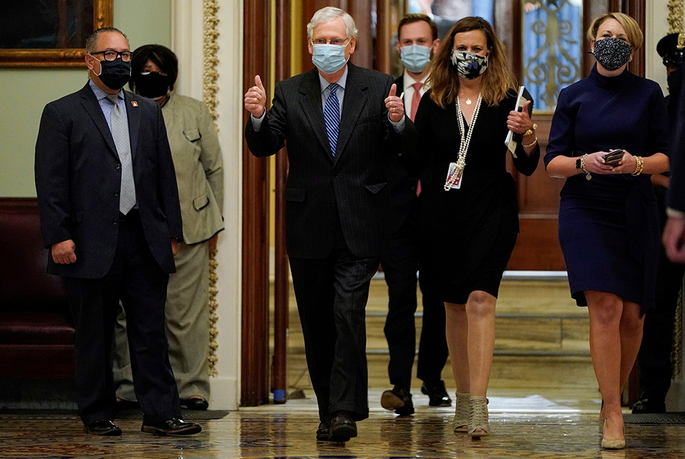 Senate Majority Leader Mitch McConnell, R-Ky., gives a thumbs up after the confirmation vote of Amy Coney Barrett to the Supreme Court on Capitol Hill Oct. 26, 2020, in Washington. They voted 52-48 to confirm President Donald Trump's nominee. (CNS/Reuters Senate Majority Leader Mitch McConnell, R-Ky., gives a thumbs up after the confirmation vote of Amy Coney Barrett to the Supreme Court on Capitol Hill Oct. 26, 2020, in Washington. They voted 52-48 to confirm President Donald Trump's nominee. (CNS/Reuters